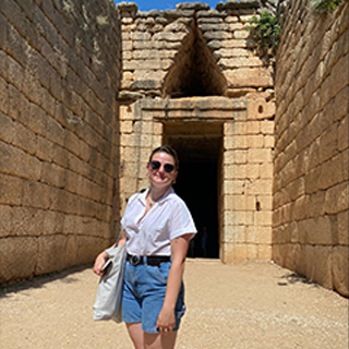 Image of Meghan Hannum standing in front of ancient ruins