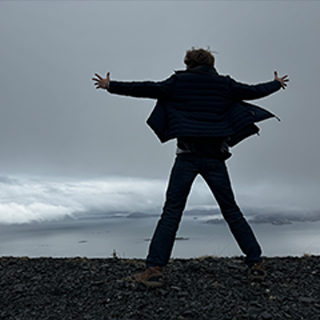 Image of Tyler on a mountain overlook