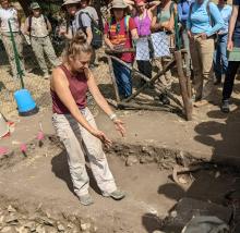 Image of Melissa Ludke speaking at the Cosa excavation site